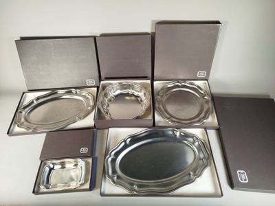 six silver trays in a box on a table
