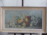 une photo d'un tableau représentant des fleurs posé sur un chevalet
