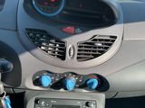 a car dashboard with a digital clock on it