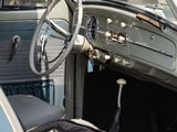 a blue and white car with a steering wheel and dashboard