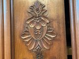 a wooden door with a carved design on it