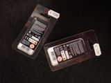 two cell phones that are sitting on a table