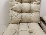 a chair that has a pillow on top of it