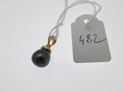 a tag with a black pearl attached to it