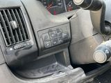 a dashboard of a car with a steering wheel and dashboard controls