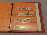 a red binder with stamps on it and a red binder with stamps on it