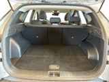the back of a car with the trunk open and the seats down