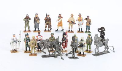 a lot of figurines of soldiers on a white surface