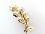 gold plated brooch with a leaf motif and a diamond center