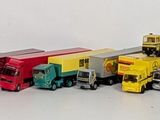 a lot of toy cars that are lined up on the wall