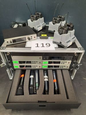 a lot of microphones in a case on a table