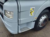 a close up of the front of a truck with its door open