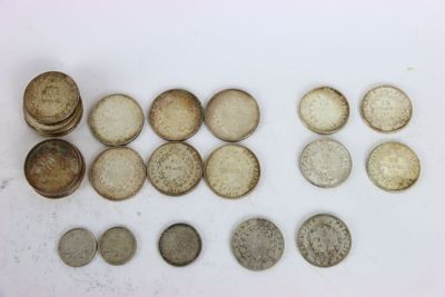 some old coins are sitting on a white surface