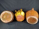 three different types of vases sitting next to each other on a black background