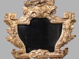 a gold frame with a lion head on it