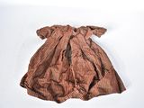 brown striped dress on a white background with a bow