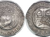 a close up of a coin with a crown on it