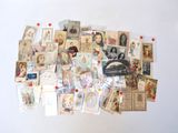 a pile of old postcards on a white surface
