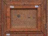 an old picture of a wooden frame with a coin in it