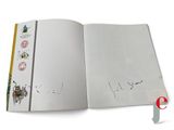 an open book with a drawing of a bug on it