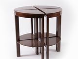 the two tables are made out of wood and have a circular shape