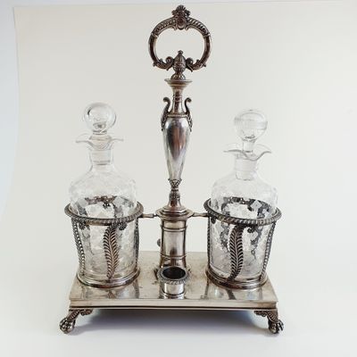 a silver plate with two glass bottles on it