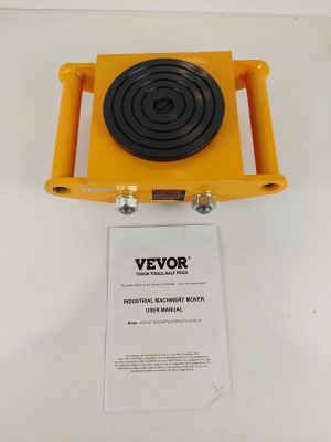 un gros plan d'un objet jaune et noir sur une surface blanche