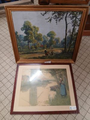 a picture of a painting on the floor next to a picture of a woman