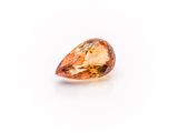 an orange diamond on a white background