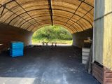 a large open building with a lot of wood in it