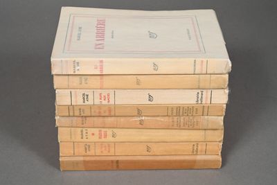 several books stacked on top of each other on a table