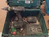 a green box with tools in it sitting on a table