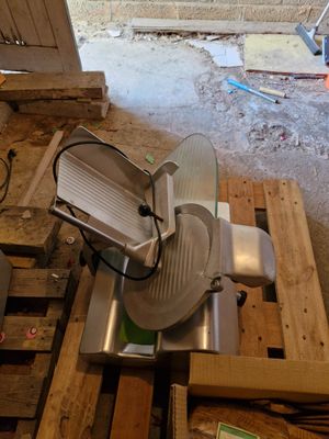 an image of a kitchen with a large slicer on a pallet