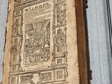 an old book with a drawing on it sitting on a table