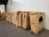 several cardboard boxes are lined up in a row in a warehouse