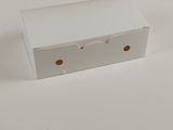 a white box with holes on it sitting on a table