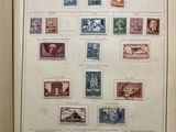 an open book with a bunch of different stamps on it
