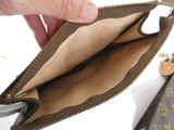 a person opening a wallet with a pair of scissors in it