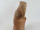 a small piece of pottery that is sitting on a white surface