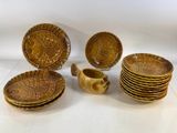 many plates and bowls that are sitting on a table
