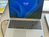 two laptops that are sitting on a table