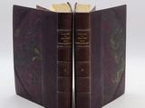 two books that are open on a white surface