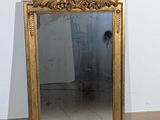 a mirror that is sitting on the floor in front of a wall