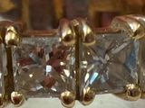 a close up of a diamond ring on a table