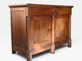 an old wooden cabinet with two doors and a drawer on top