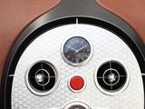 a close up of a clock on the back of a car