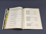 an open book with a number of numbers on it on a table