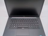 a laptop that is sitting on a white table