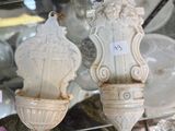 a glass case with a lot of vases on it