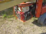 a small engine attached to the back of a truck